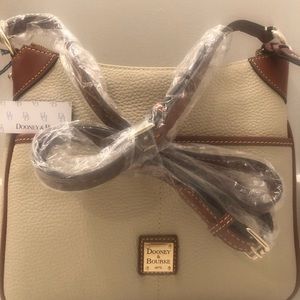 Brand new with tags Dooney & Bourke crossbody bag cream/tan with red interior